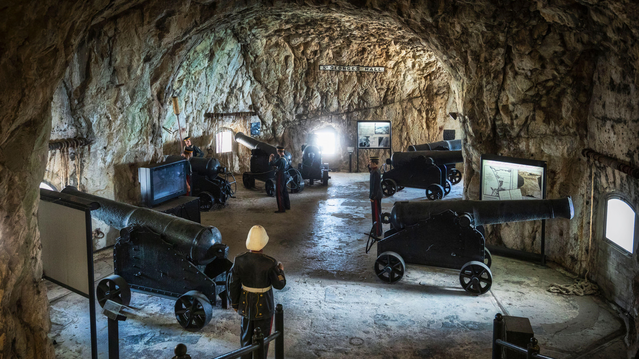 Great Siege Tunnels, Gibraltar, featuring a tableau of seven cannons overlooking Spanish positions